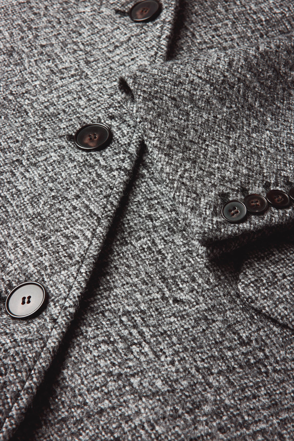Manteau tailleur en laine mouchetée
