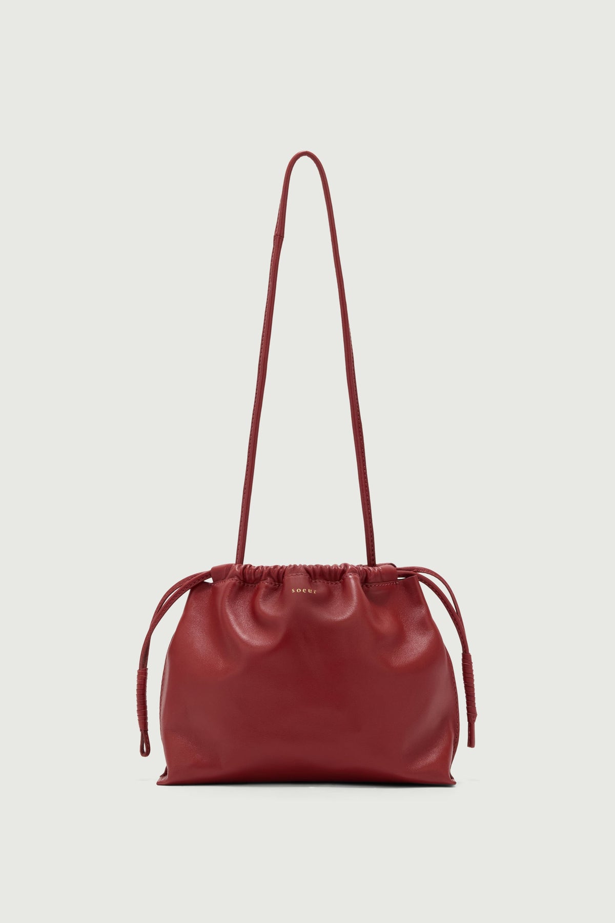 Pochette froncée en cuir vernis